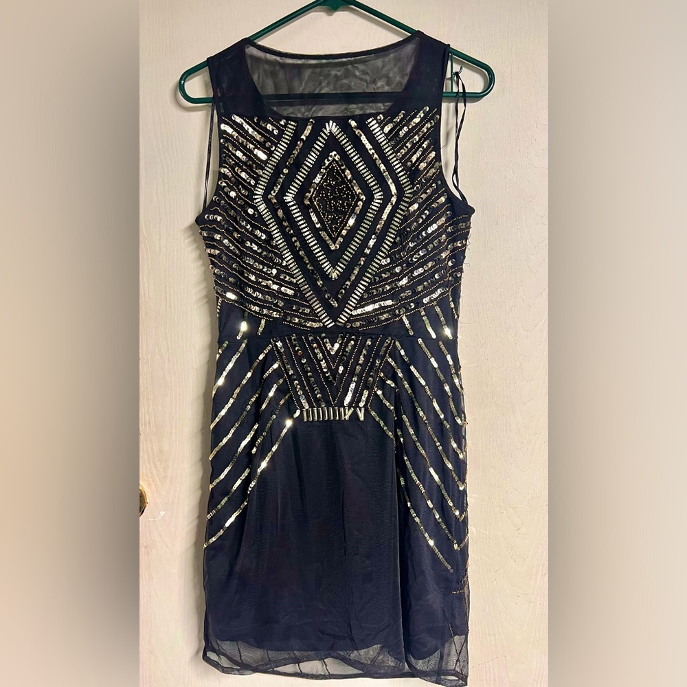 Sexy black sheer layered dress with gold embellishments. Size 10. Used twice